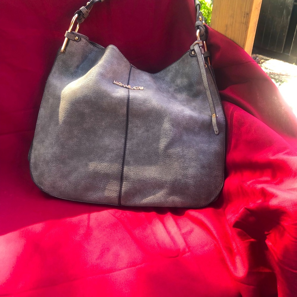 Not authentic! However great bag. Wore x2 slight spot on handle.